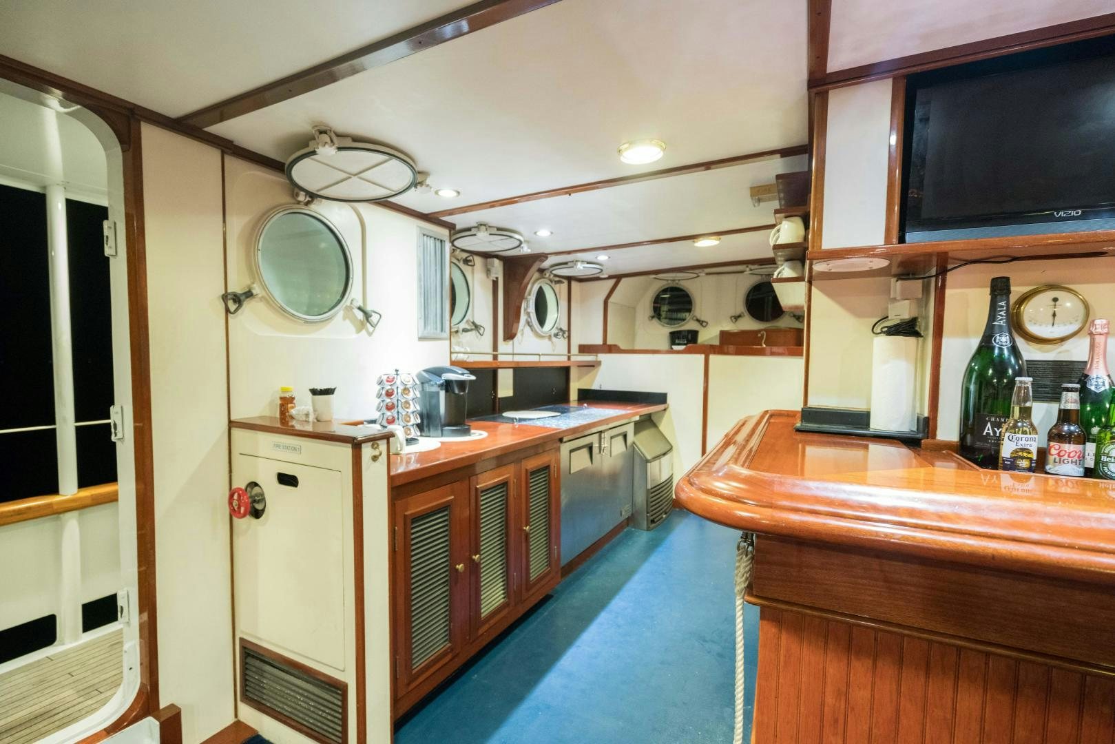 a kitchen with a blue floor aboard ARABELLA II Yacht for Sale