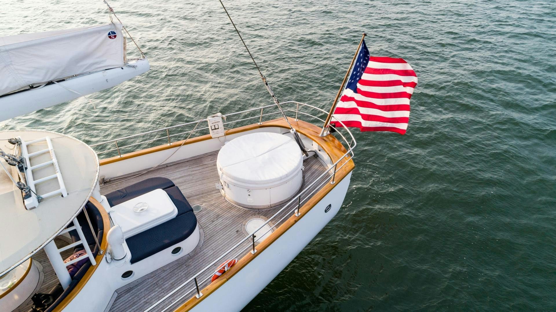 a boat with a flag on the front aboard ARABELLA II Yacht for Sale