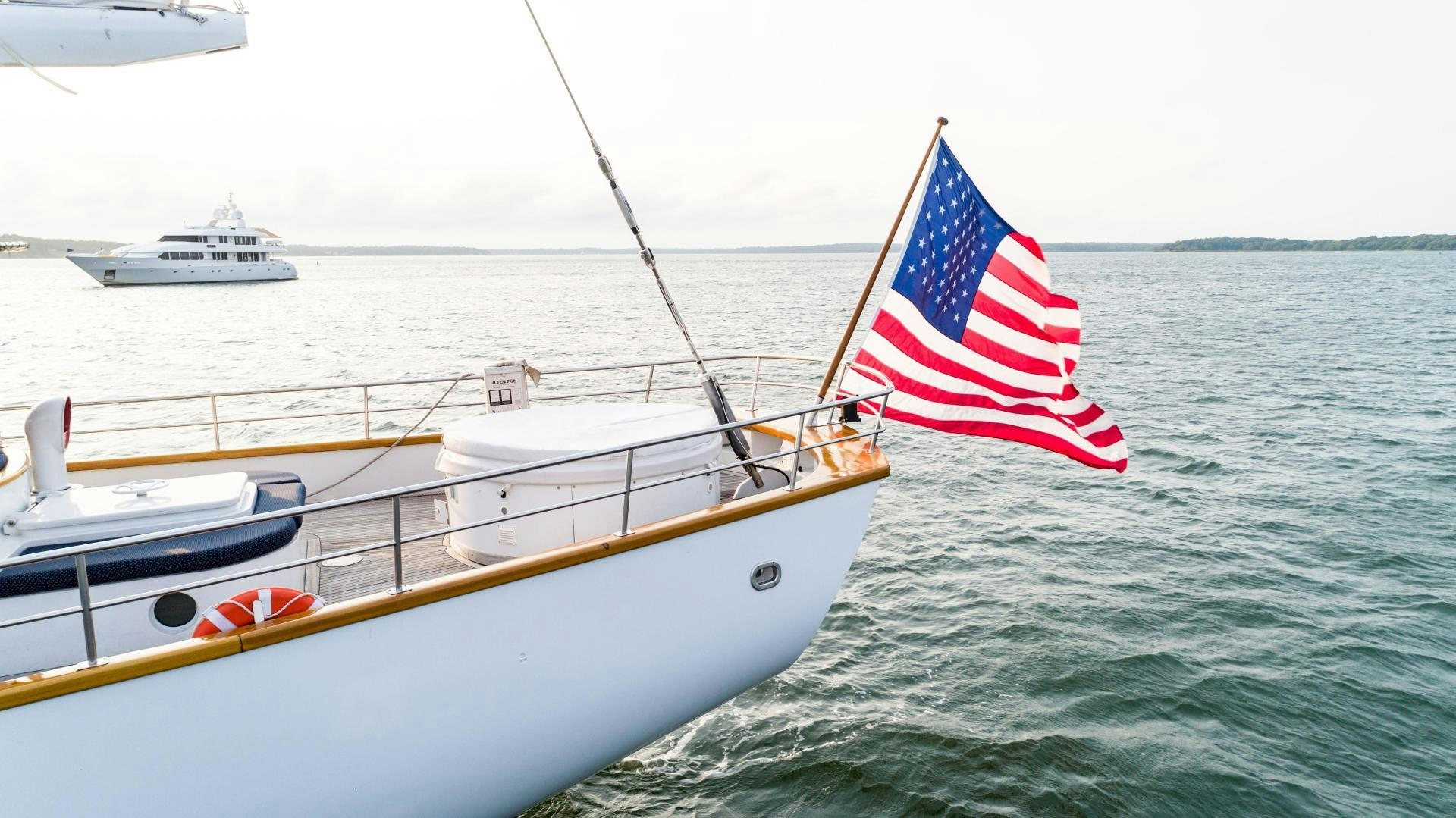 a boat with a flag on it aboard ARABELLA II Yacht for Sale