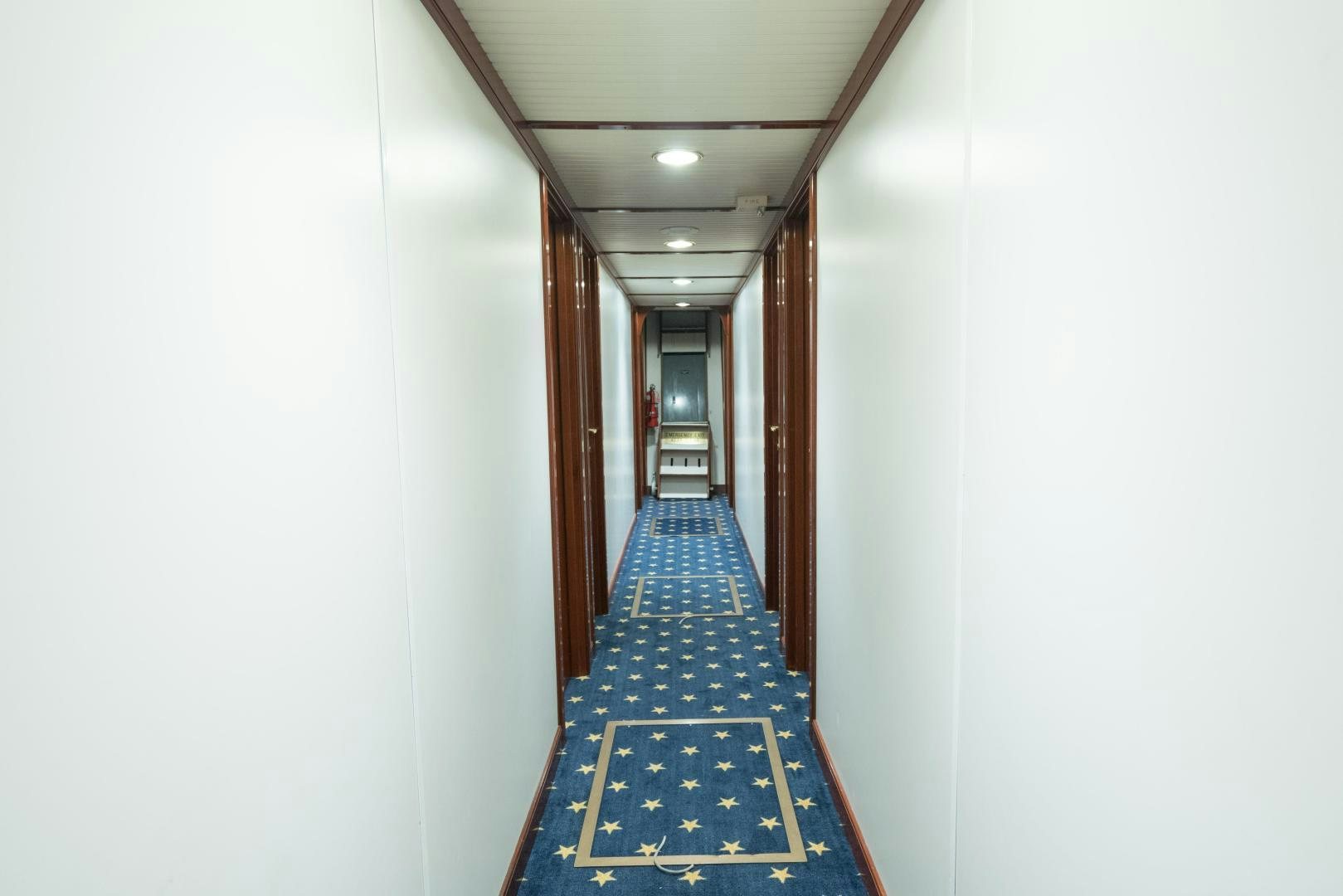a hallway with blue tile aboard ARABELLA II Yacht for Sale