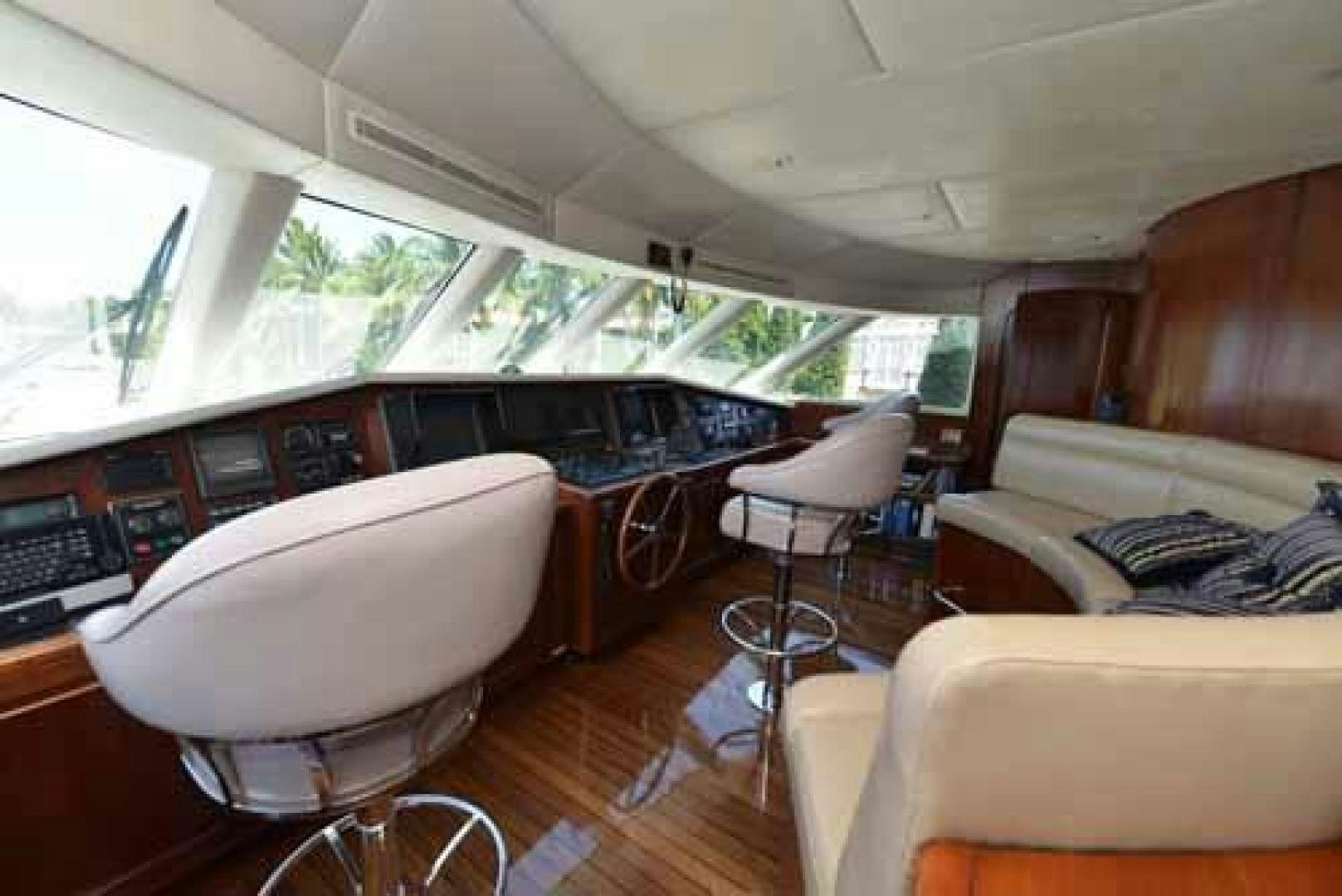 a vehicle with a table and chairs aboard UTOPIA III Yacht for Sale