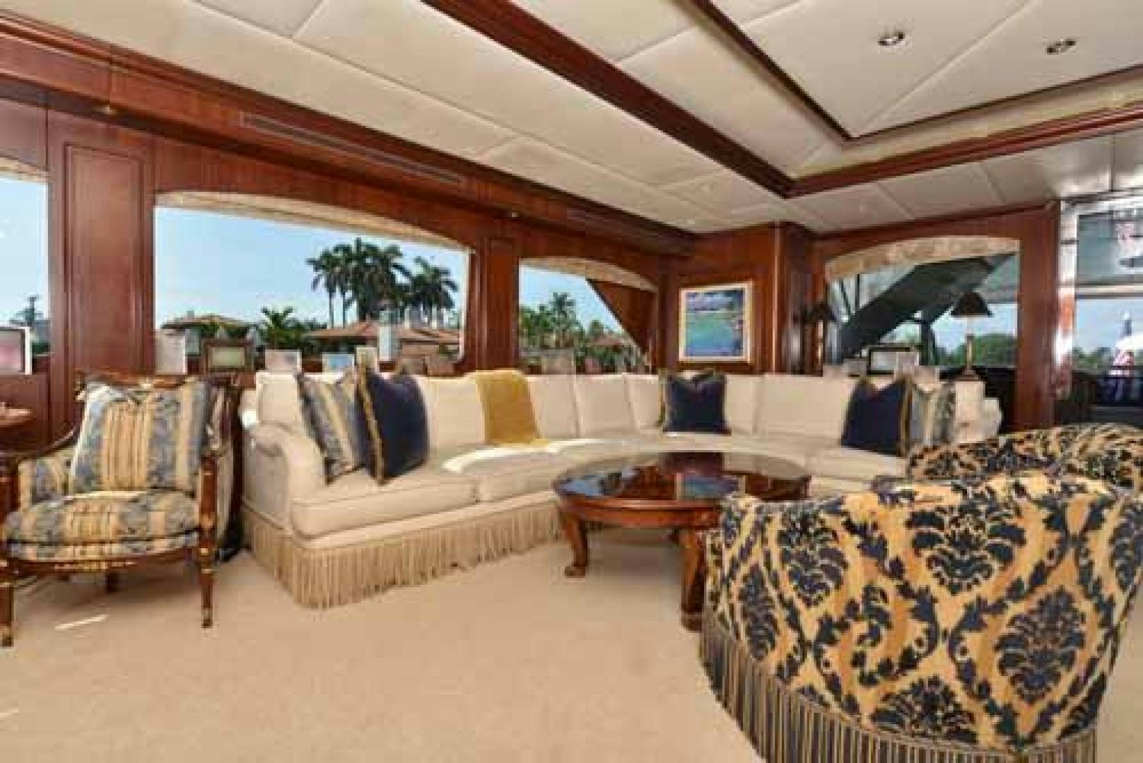 a living room with a couch and a table aboard UTOPIA III Yacht for Sale