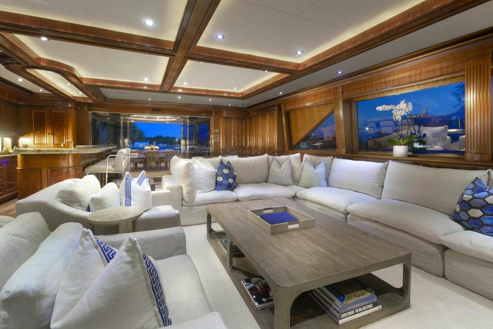 a living room with a large screen aboard FAR FROM IT Yacht for Sale