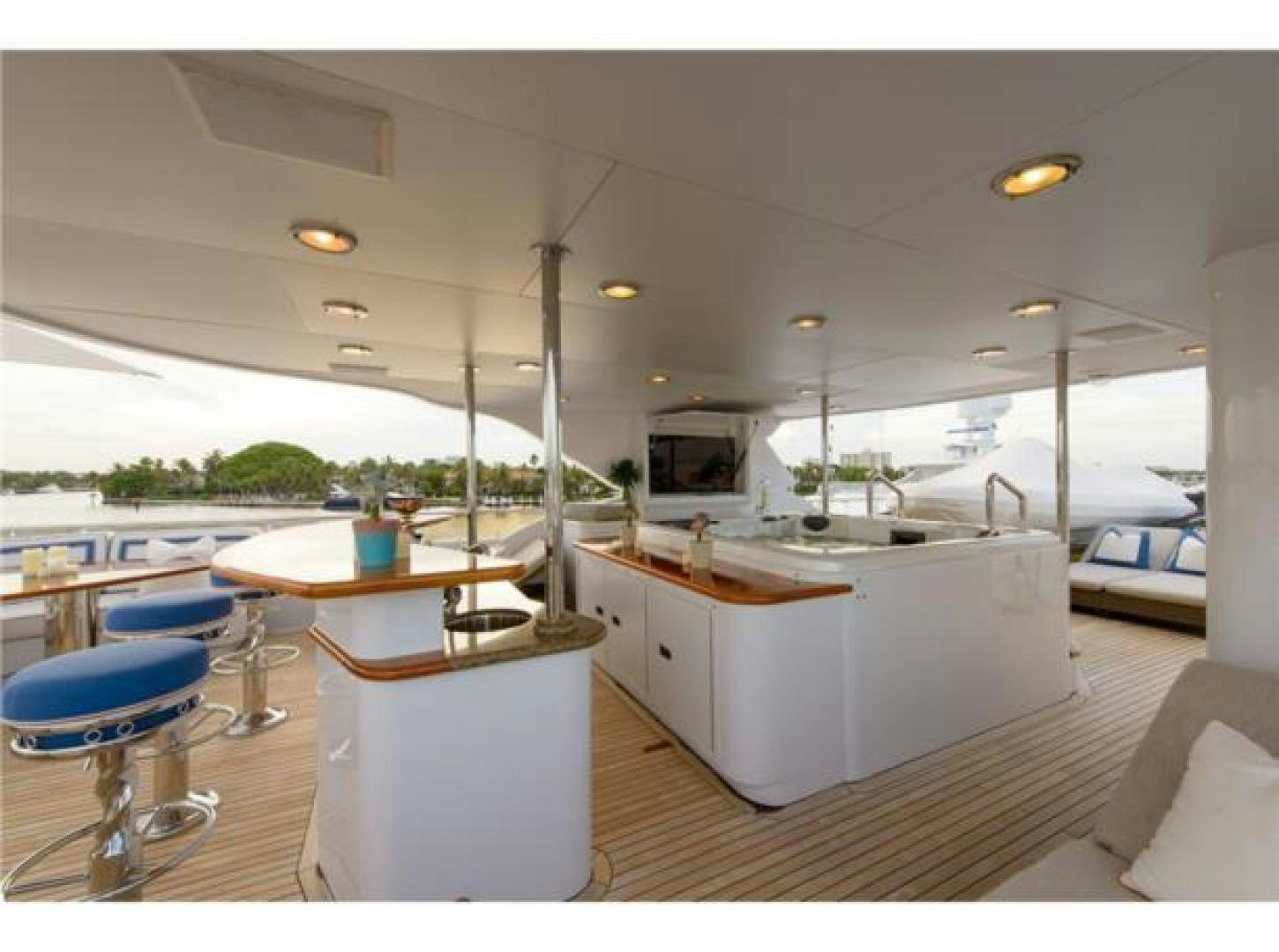 a large kitchen with a boat in the background aboard FAR FROM IT Yacht for Sale