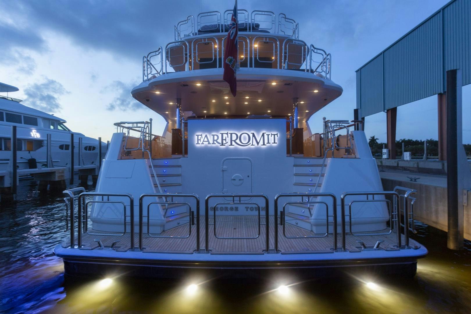a large boat on a body of water aboard FAR FROM IT Yacht for Sale
