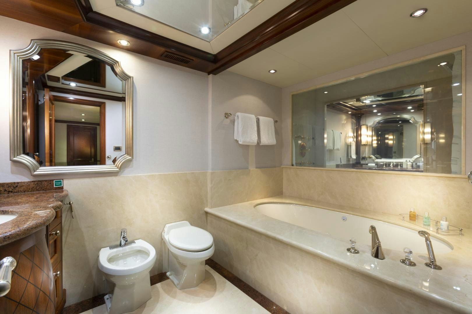 a bathroom with a large mirror aboard FAR FROM IT Yacht for Sale