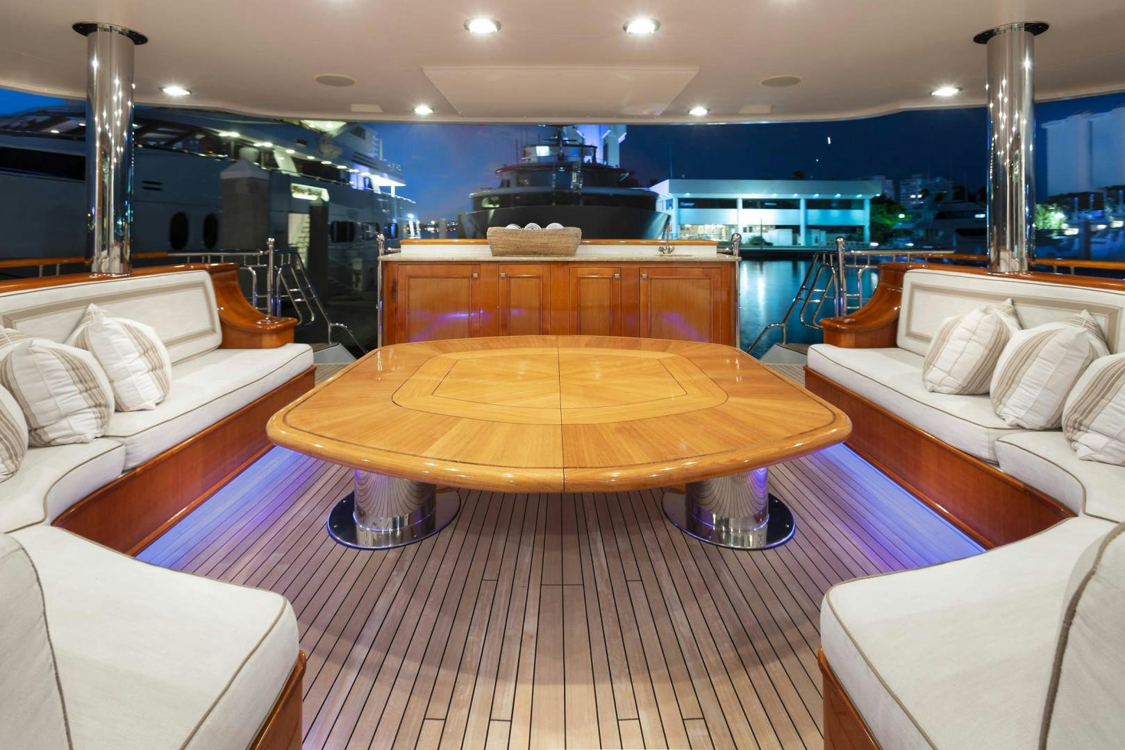 a room with a table and chairs aboard FAR FROM IT Yacht for Sale