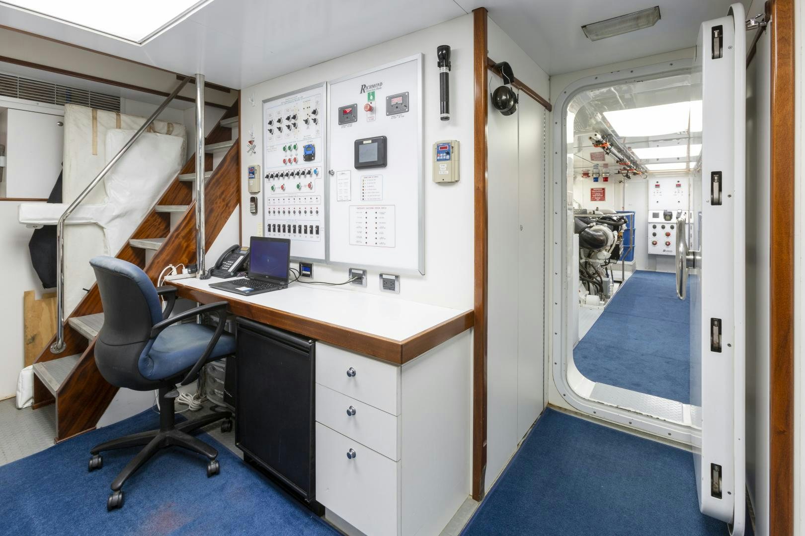 a room with a desk and a computer aboard FAR FROM IT Yacht for Sale