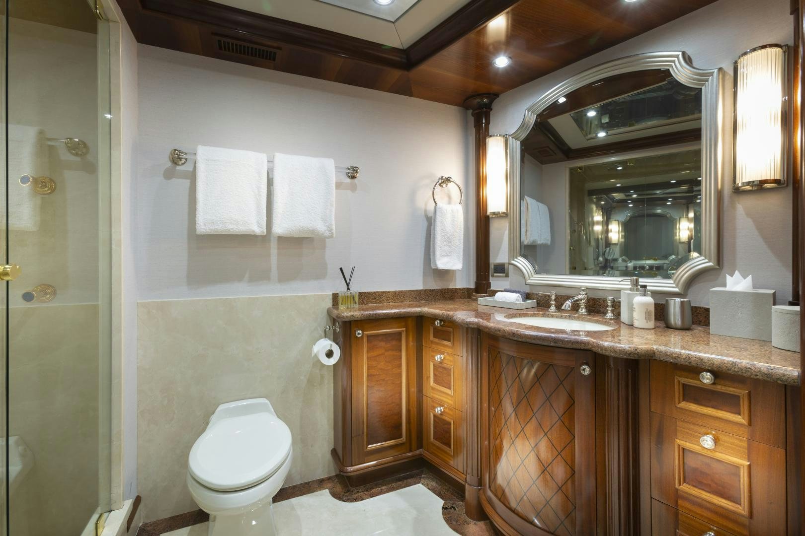 a bathroom with a large mirror aboard FAR FROM IT Yacht for Sale