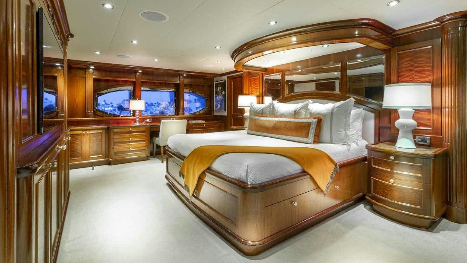 a large bedroom with a large bed aboard FAR FROM IT Yacht for Sale