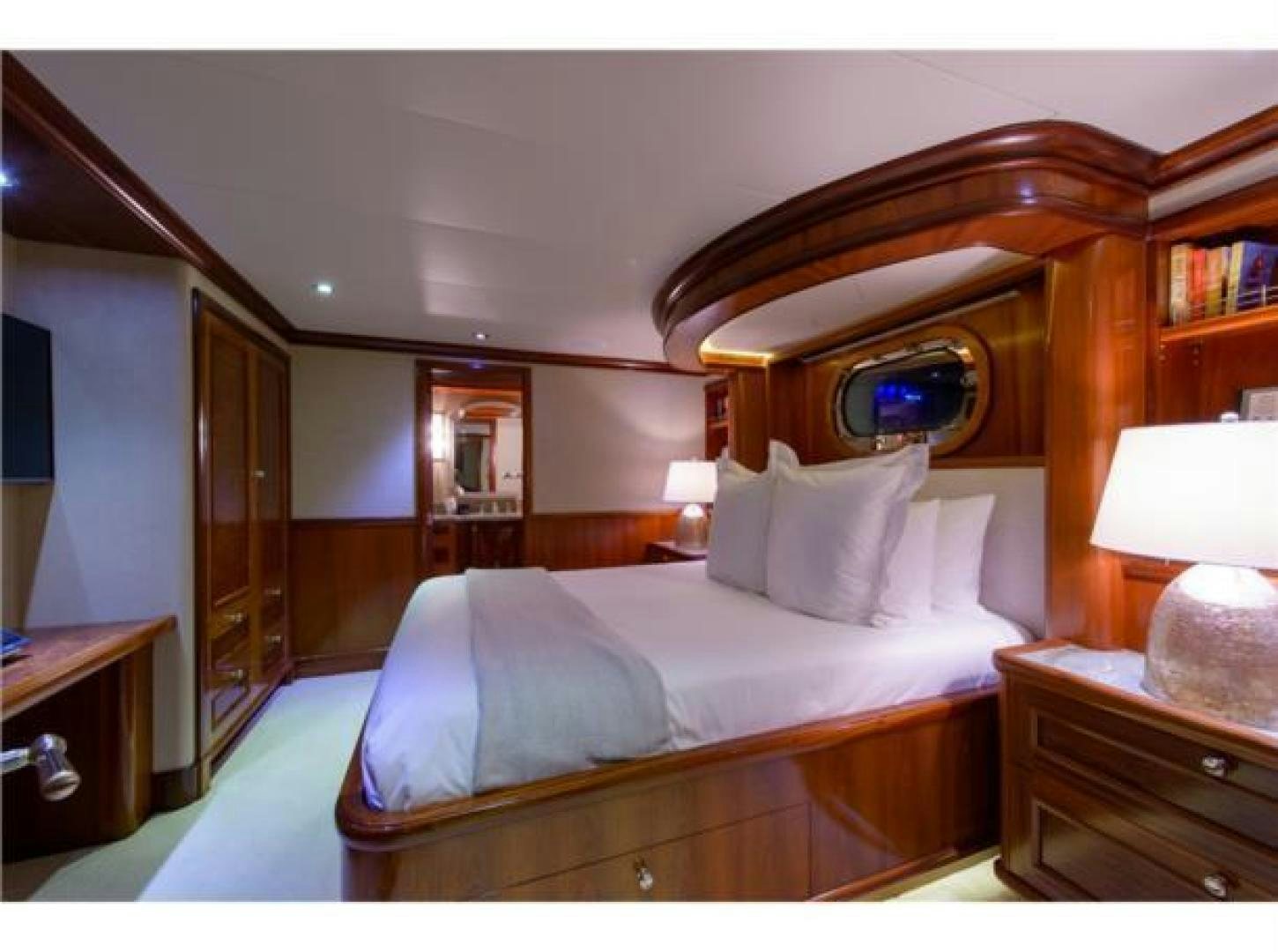 a bed with a mirror above it aboard FAR FROM IT Yacht for Sale