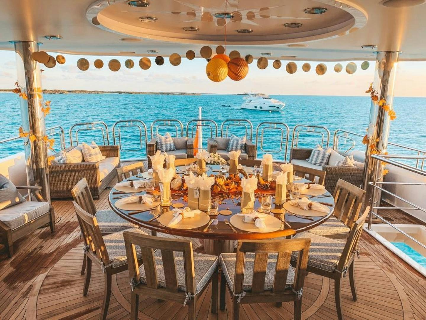 a table set for a meal on a boat aboard FAR FROM IT Yacht for Sale