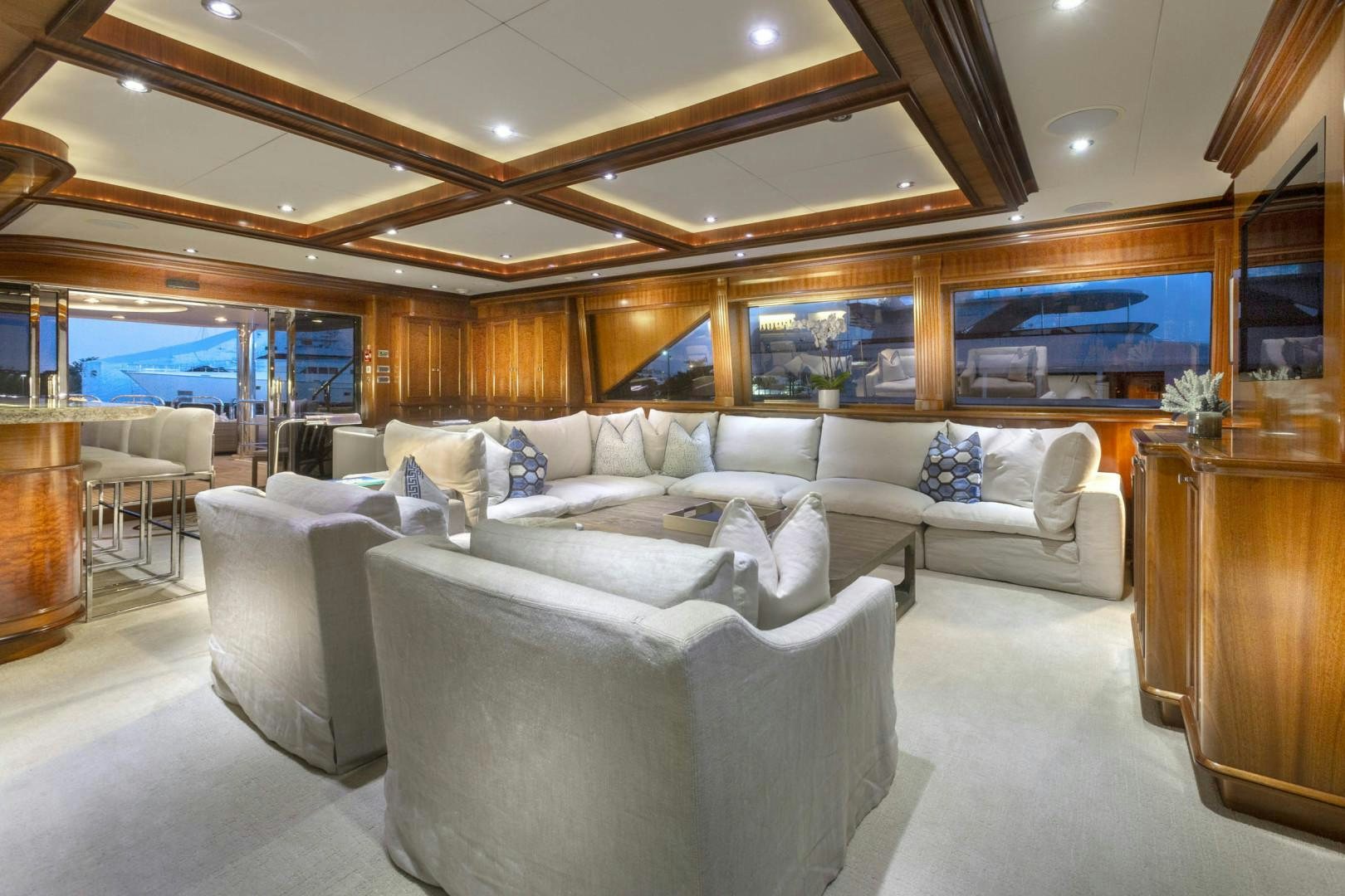 a living room with a large window aboard FAR FROM IT Yacht for Sale