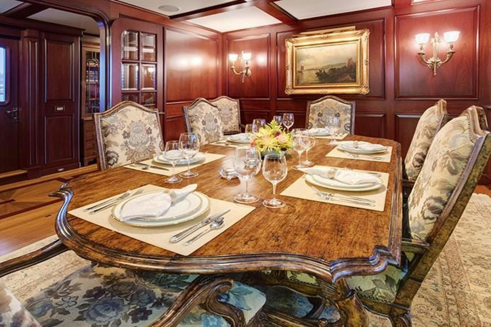 a dining room table set for a dinner party aboard MARLINDA Yacht for Sale
