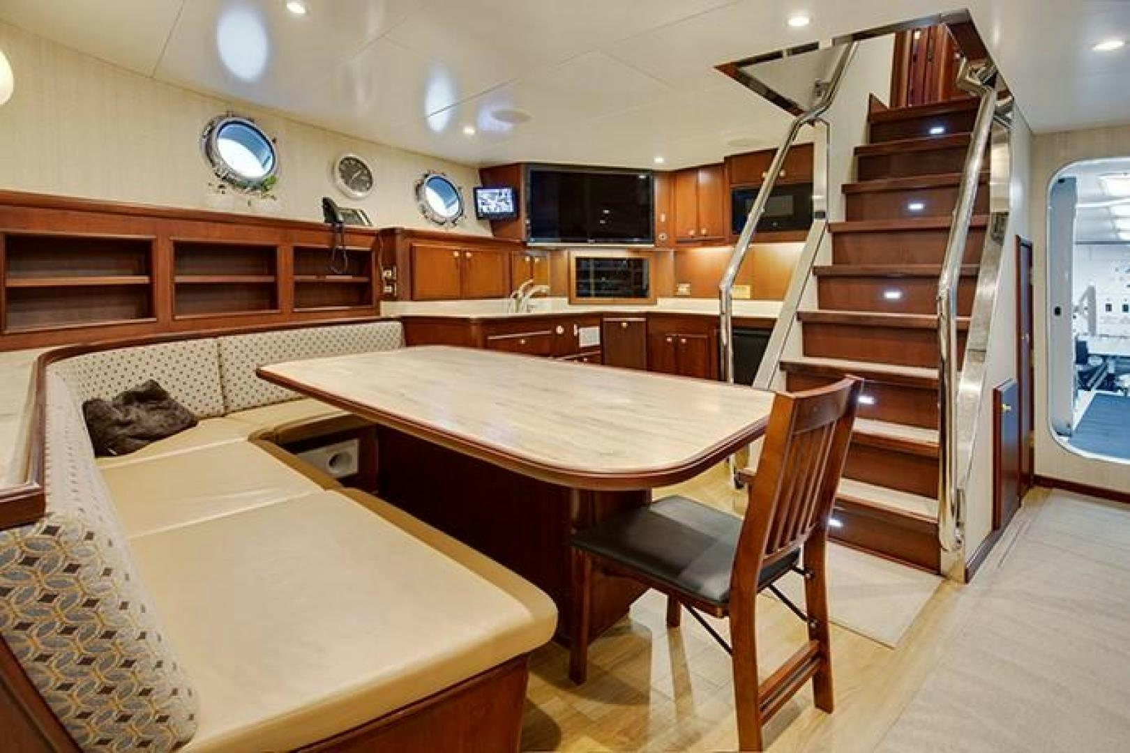 a room with a table and chairs aboard MARLINDA Yacht for Sale
