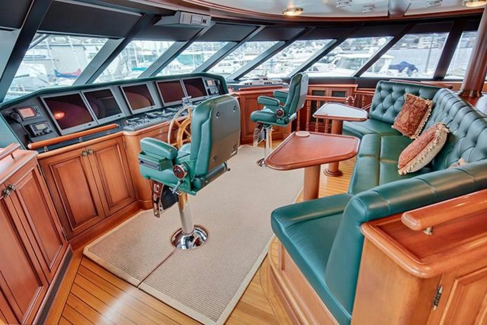 a room with a green chair and a green chair aboard MARLINDA Yacht for Sale