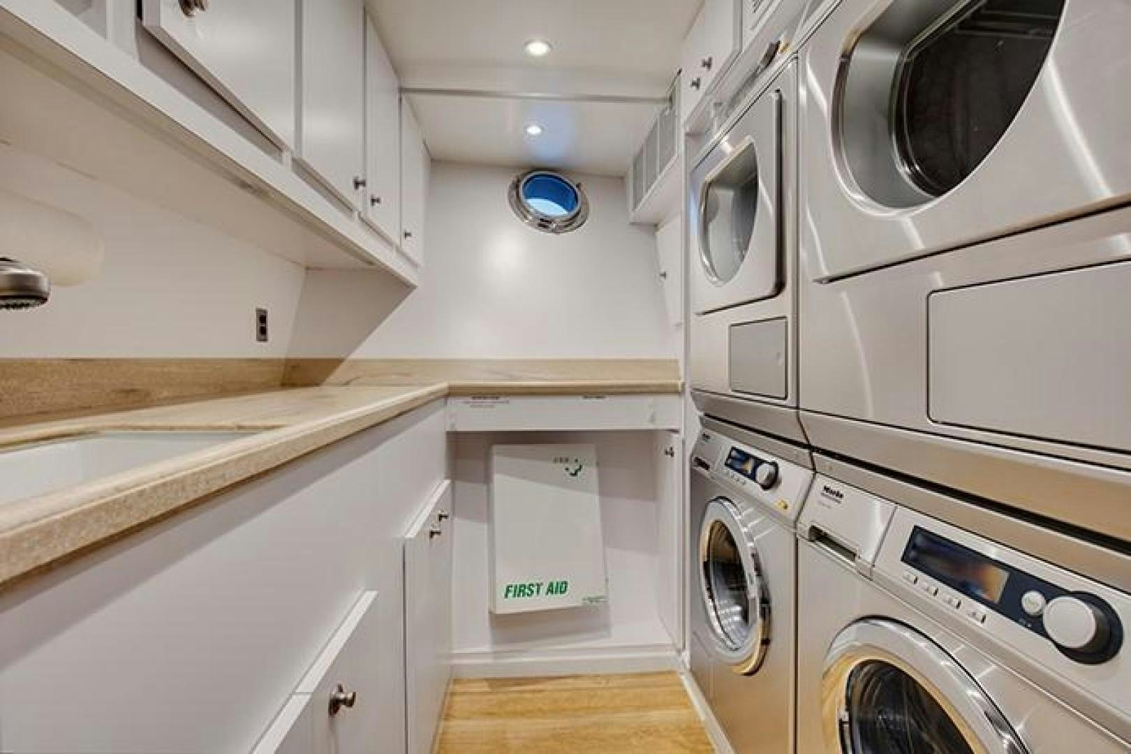 a kitchen with white cabinets aboard MARLINDA Yacht for Sale