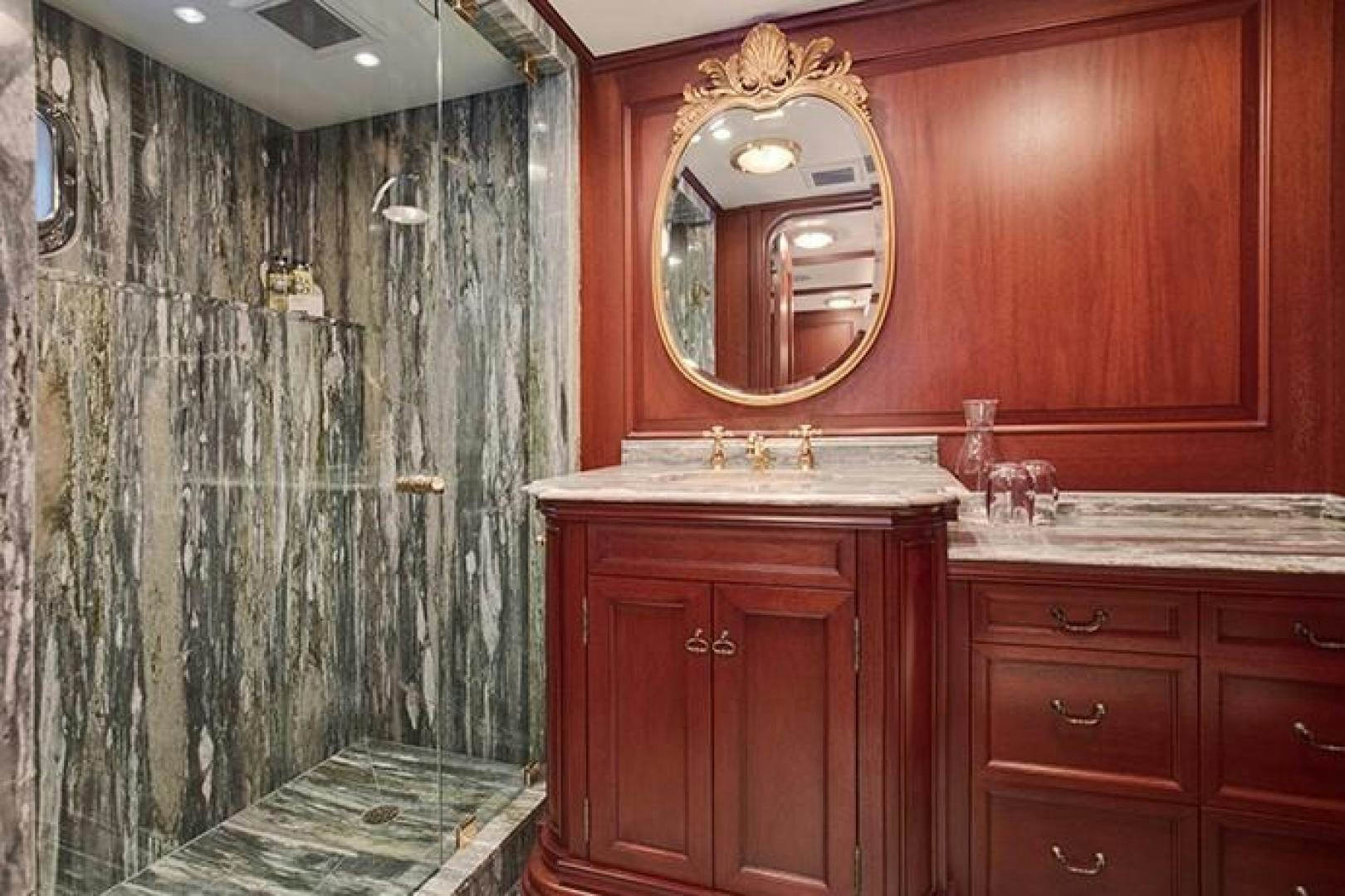 a bathroom with a large mirror aboard MARLINDA Yacht for Sale