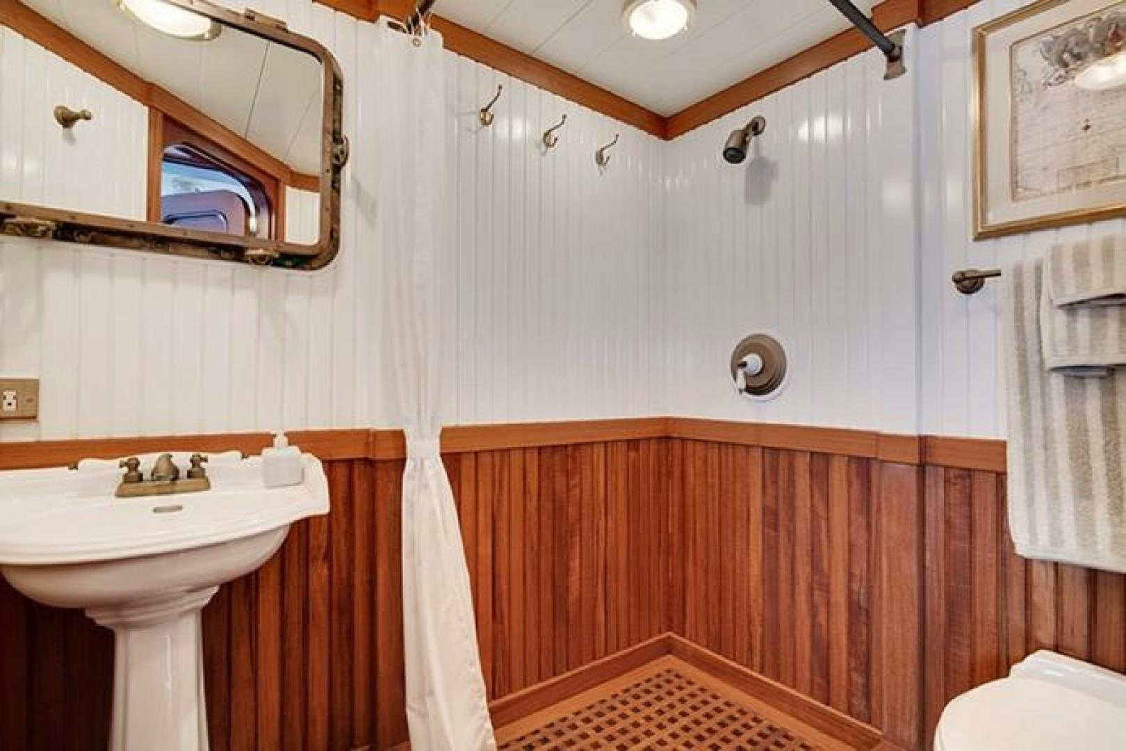 a bathroom with a sink and a mirror aboard MARLINDA Yacht for Sale