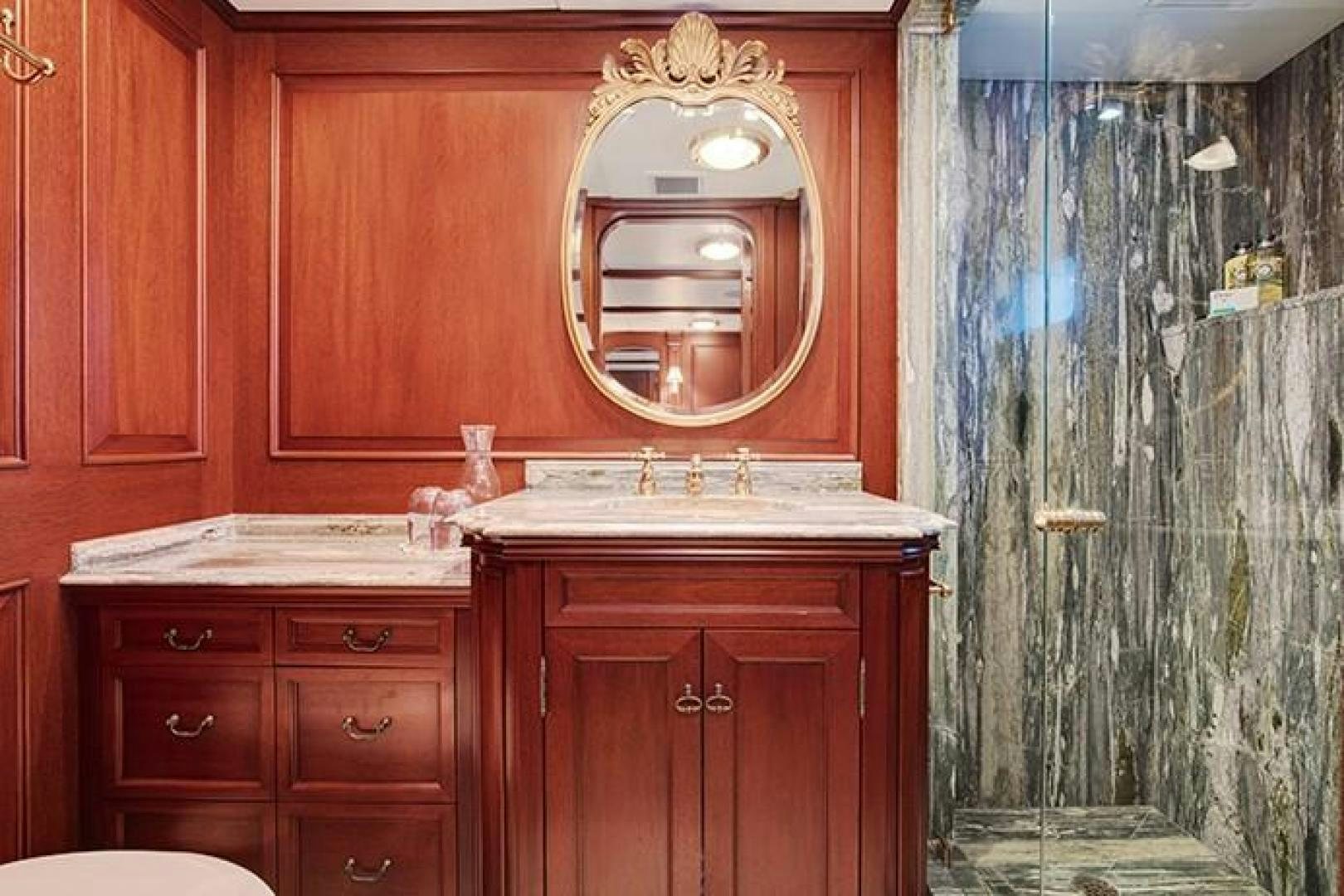 a bathroom with a sink and a mirror aboard MARLINDA Yacht for Sale