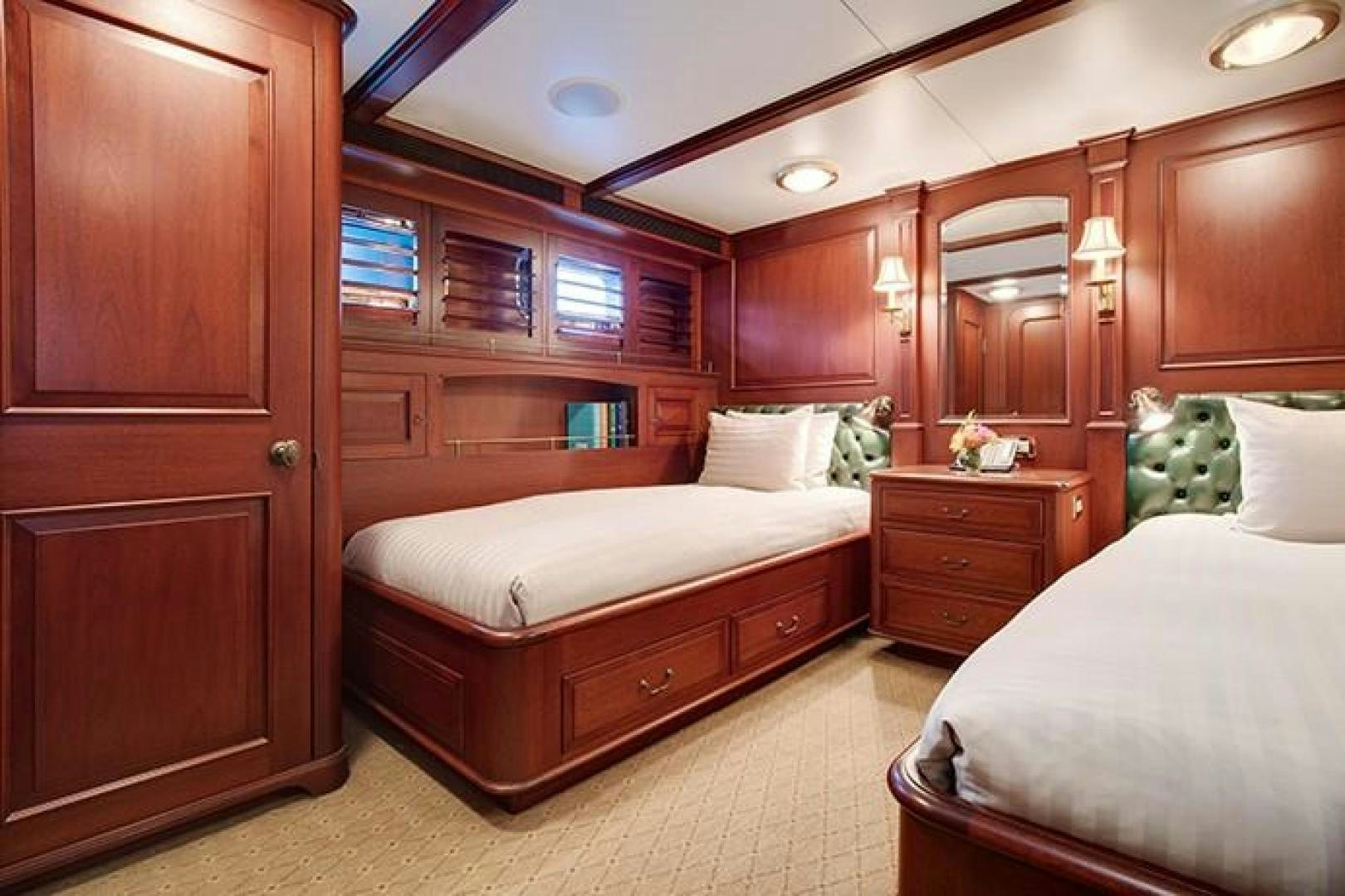 a room with a bed and a mirror aboard MARLINDA Yacht for Sale