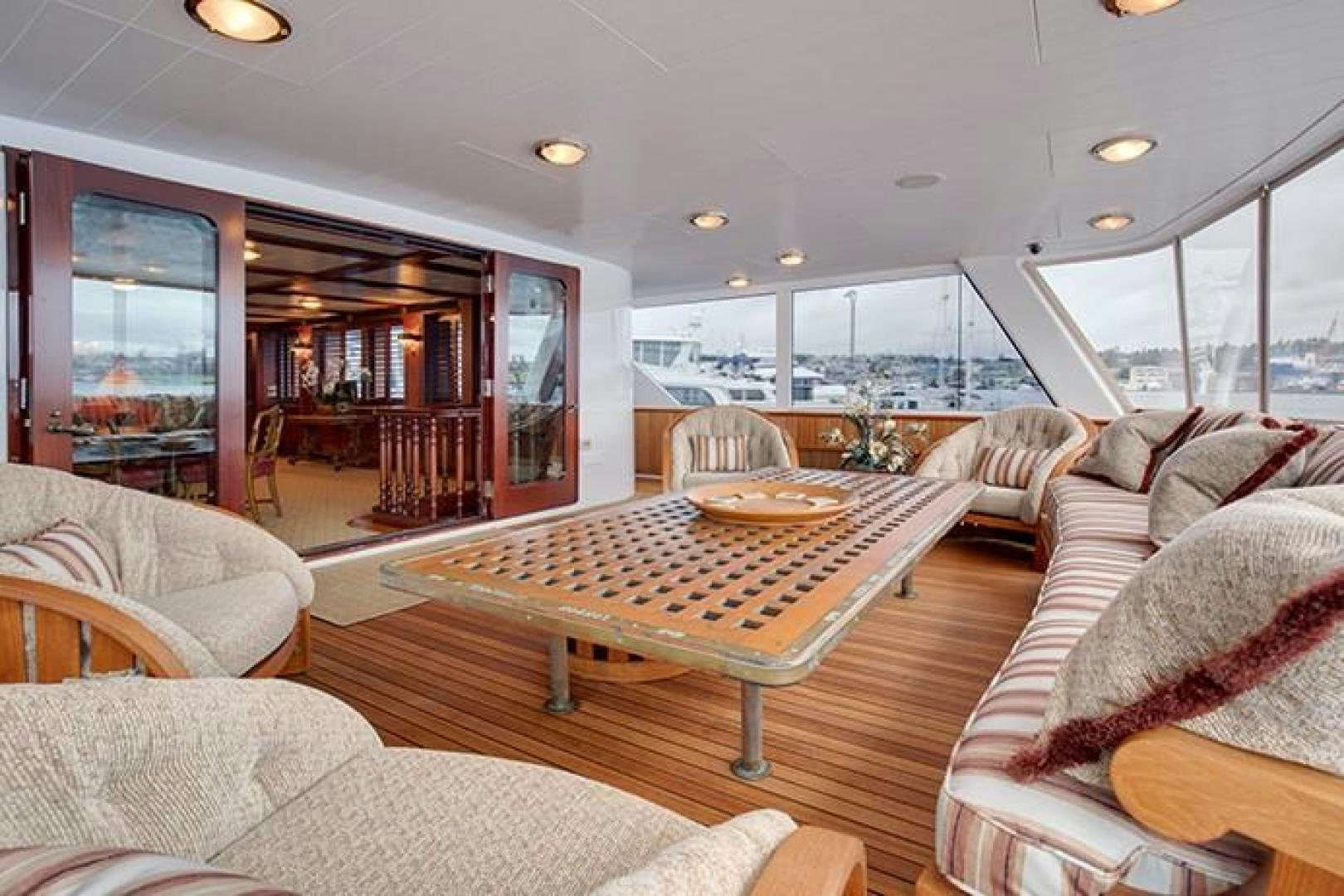 a living room with a large glass window aboard MARLINDA Yacht for Sale