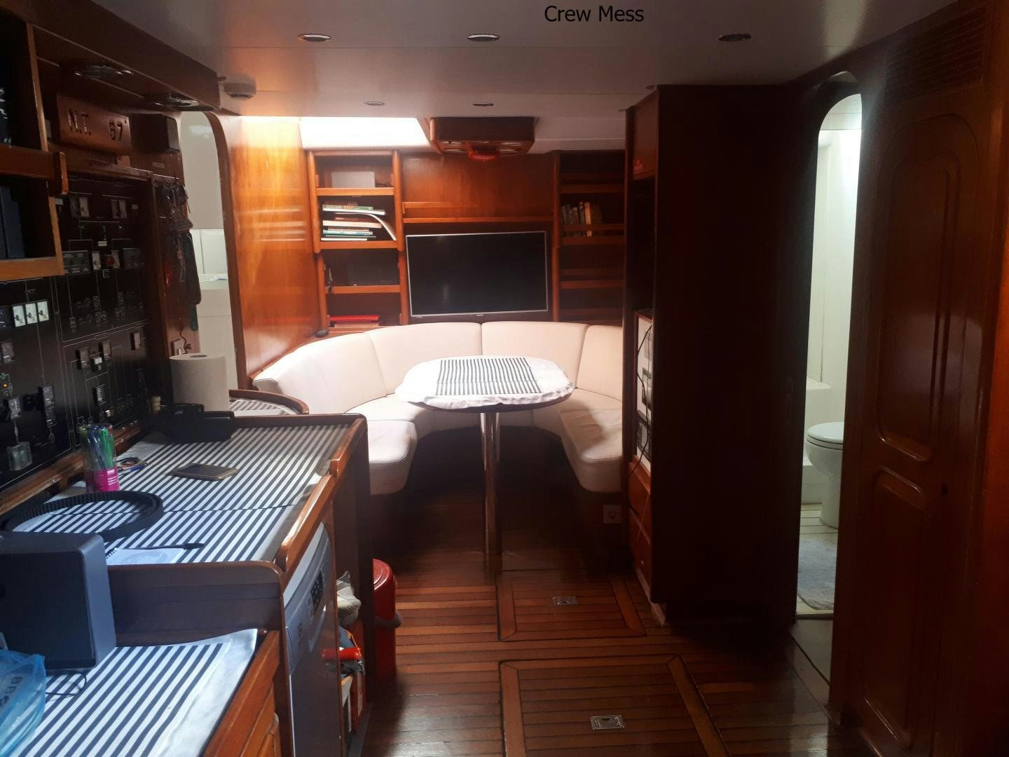 a room with a bed and a desk aboard LATITUDE Yacht for Sale