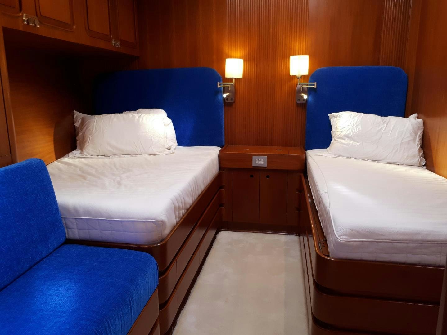 a room with two beds aboard LATITUDE Yacht for Sale