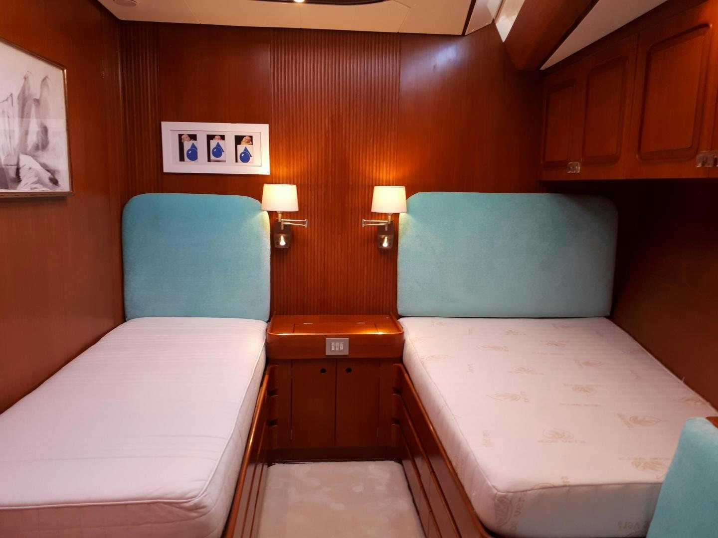 a room with two beds aboard LATITUDE Yacht for Sale