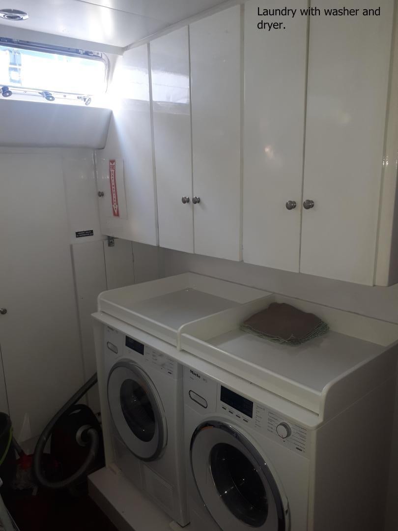 a washing machine in a room aboard LATITUDE Yacht for Sale