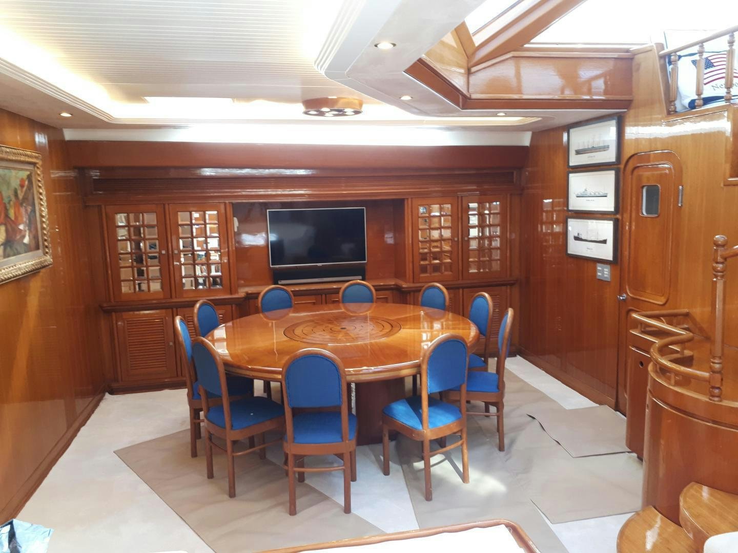 a room with a table and chairs aboard LATITUDE Yacht for Sale