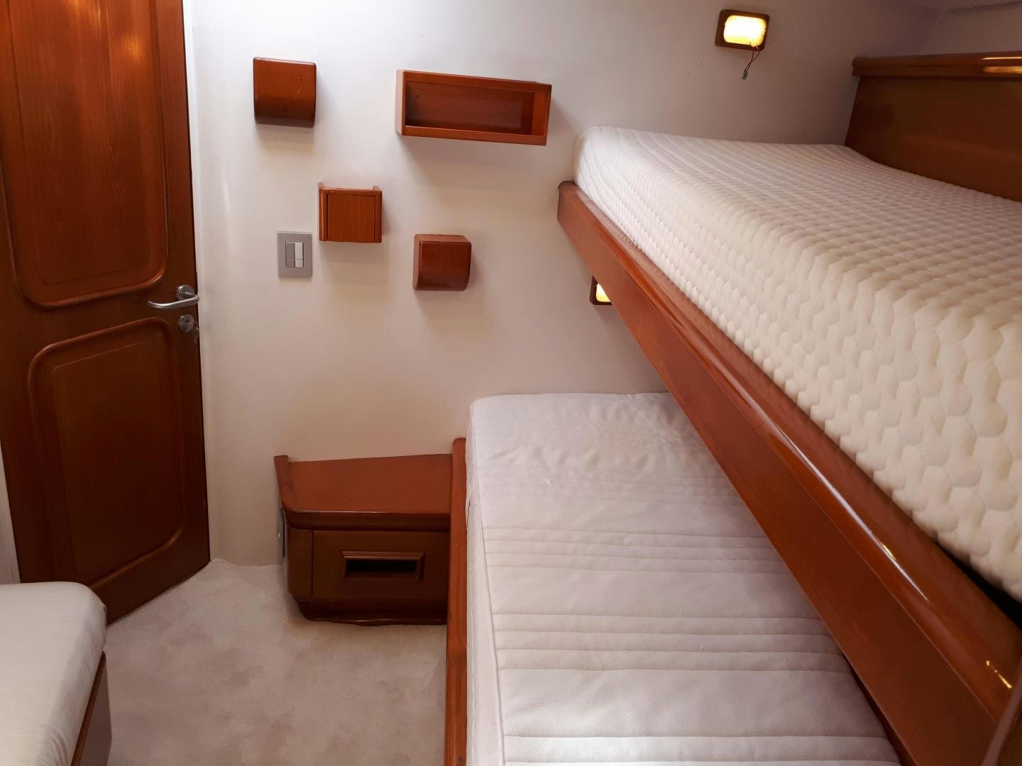a couple of beds in a room aboard LATITUDE Yacht for Sale