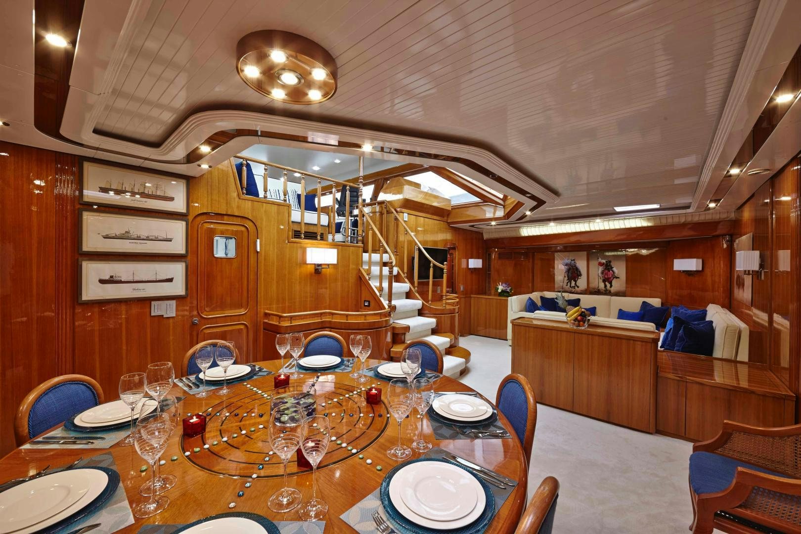 a dining room with a table set for a party aboard LATITUDE Yacht for Sale