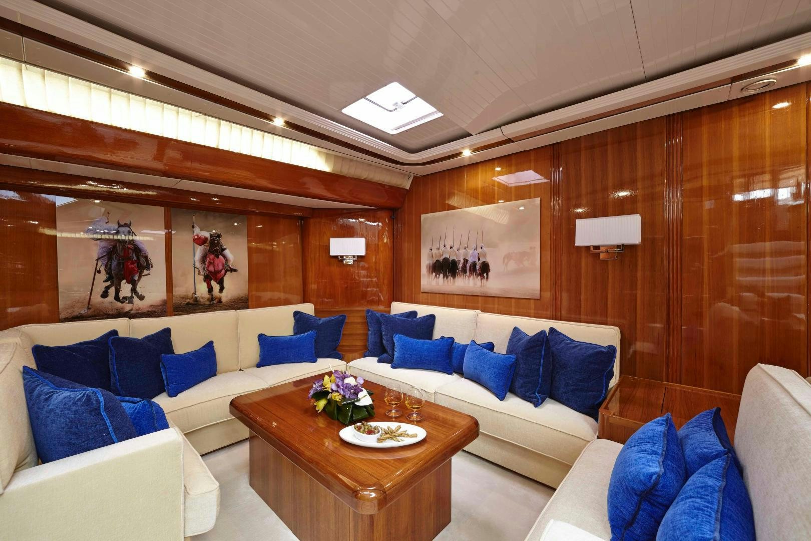 a room with a couch and a table aboard LATITUDE Yacht for Sale