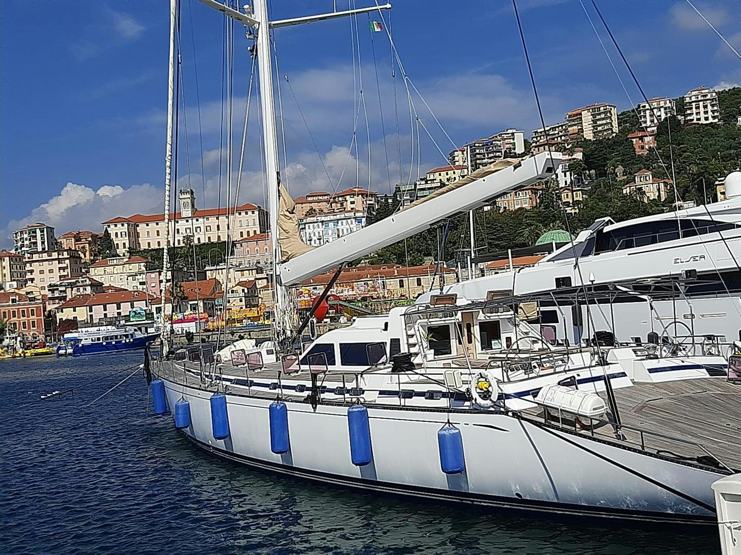a group of boats are parked in a harbor aboard LATITUDE Yacht for Sale