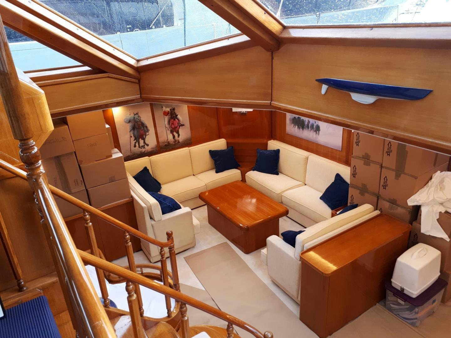 a room with a couch and a table aboard LATITUDE Yacht for Sale