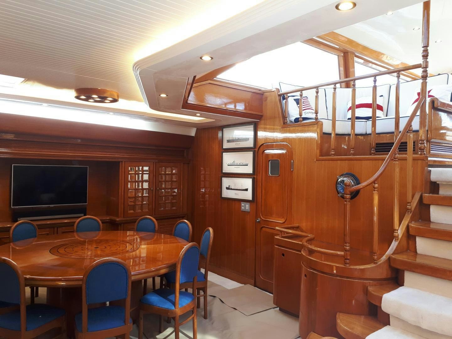 a cabin with a table and chairs aboard LATITUDE Yacht for Sale