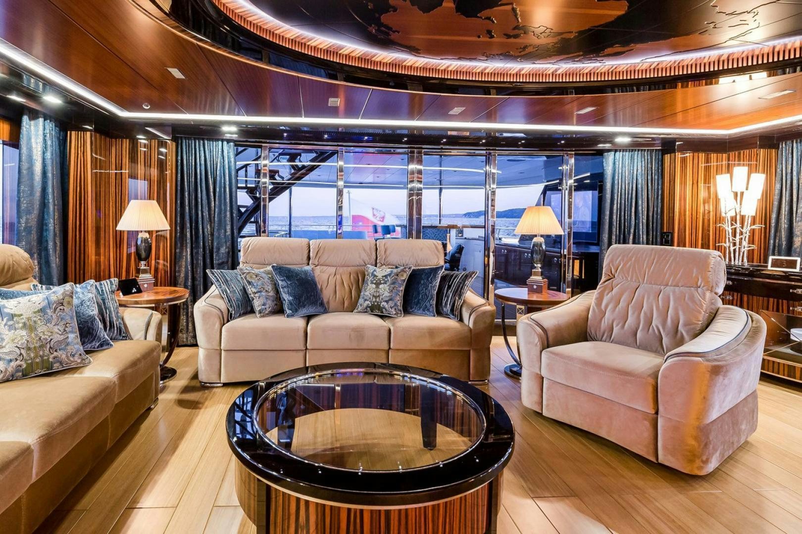 a living room with a large window aboard VIATORIS Yacht for Sale