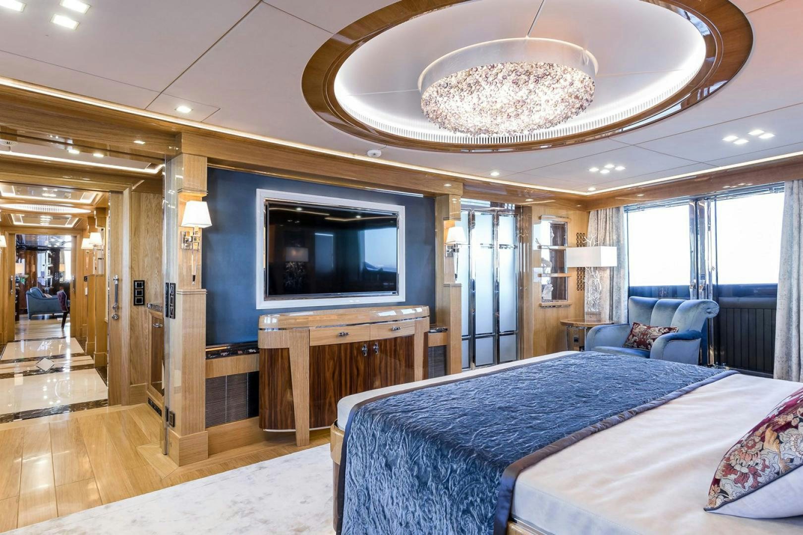 a bedroom with a large bed aboard VIATORIS Yacht for Sale