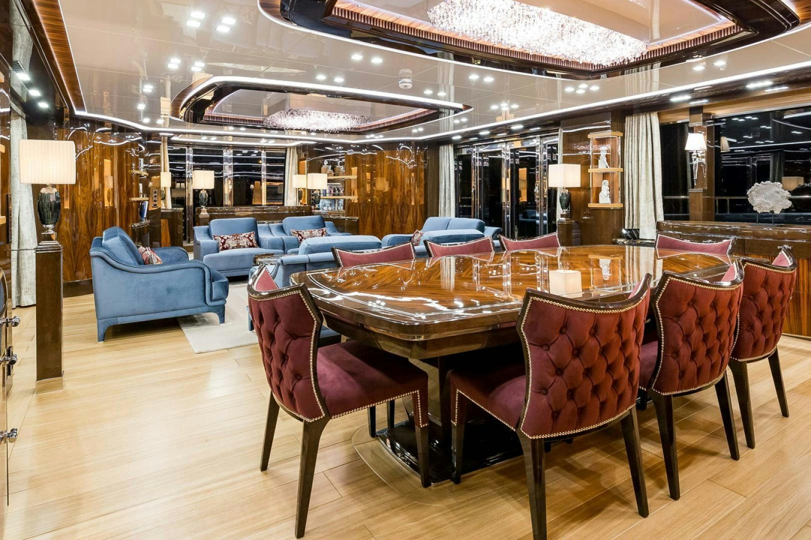 a restaurant with tables and chairs aboard VIATORIS Yacht for Sale
