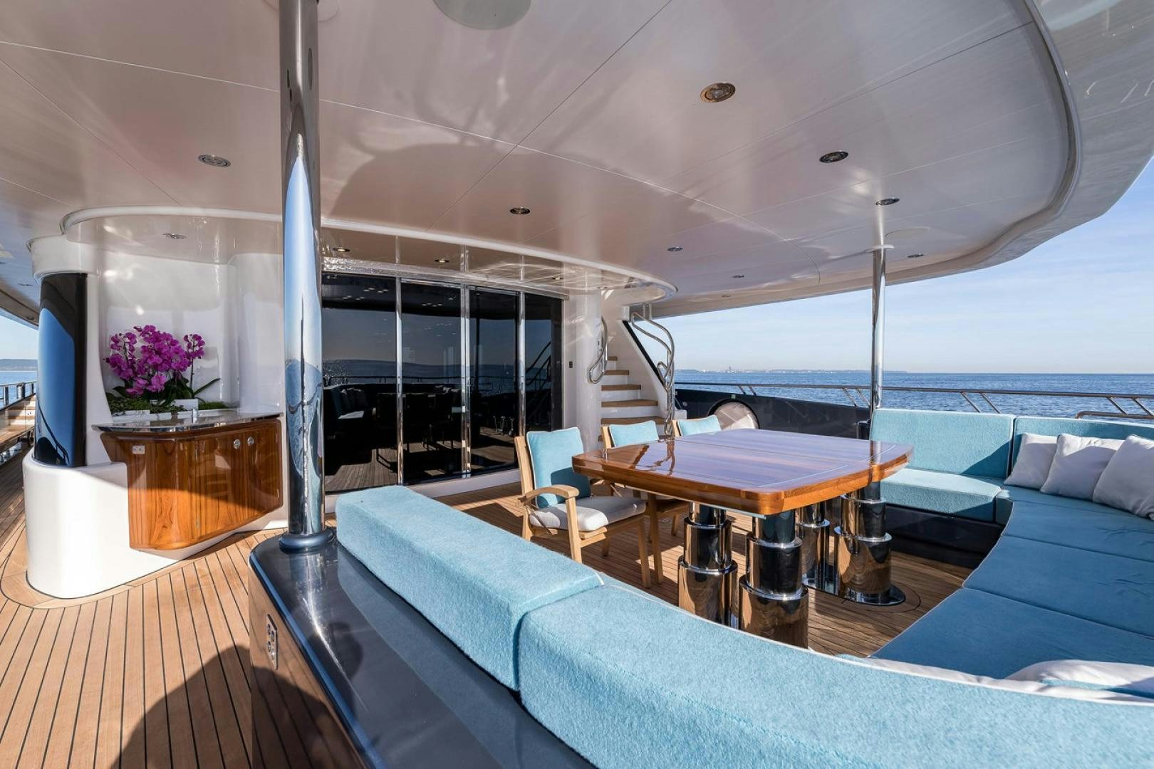 a room with a pool table and chairs aboard VIATORIS Yacht for Sale