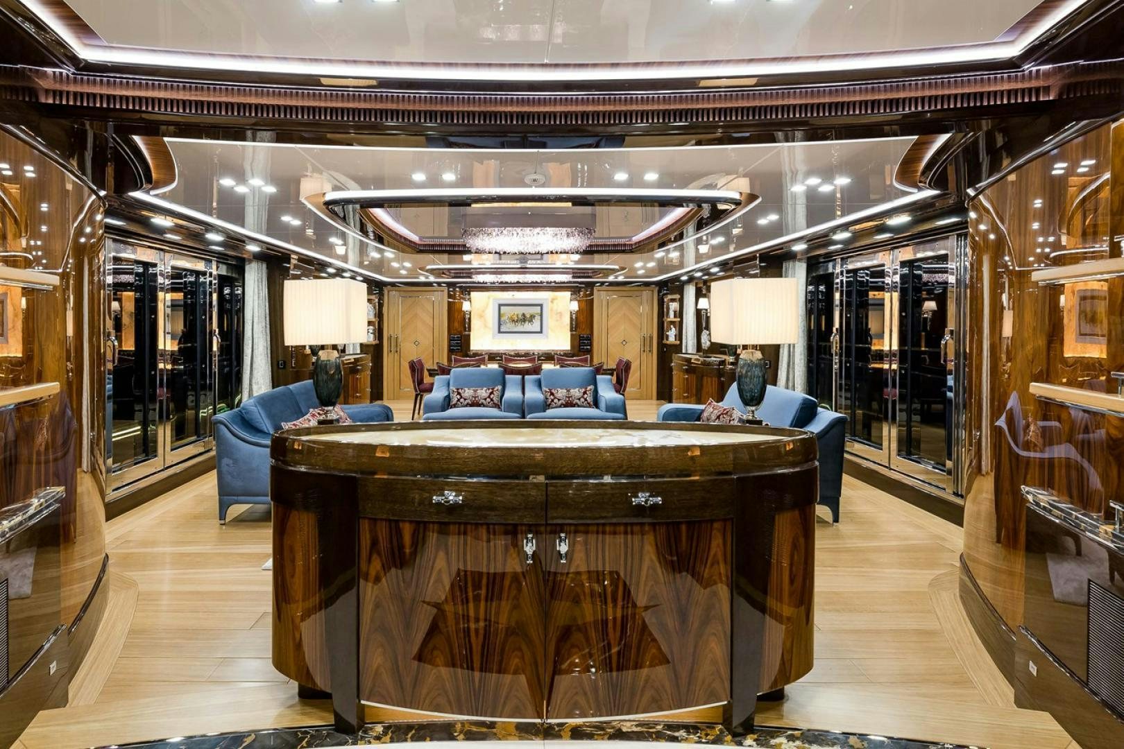 a large room with a table and chairs aboard VIATORIS Yacht for Sale
