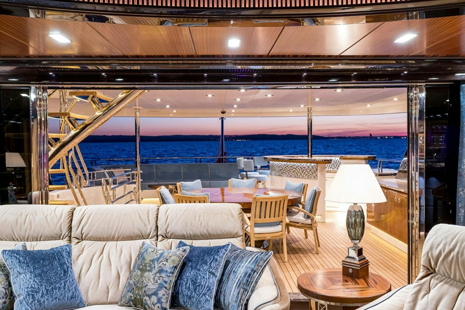 a room with a couch and a table and chairs aboard VIATORIS Yacht for Sale