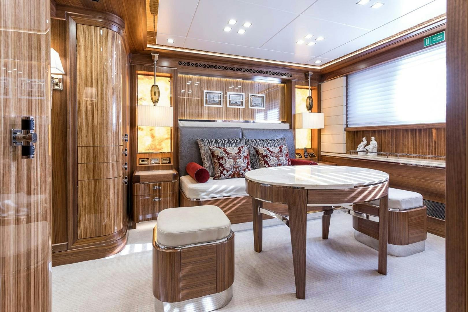 a room with a table and chairs aboard VIATORIS Yacht for Sale