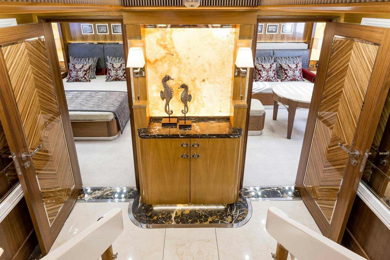 a large gold cabinet in a room aboard VIATORIS Yacht for Sale