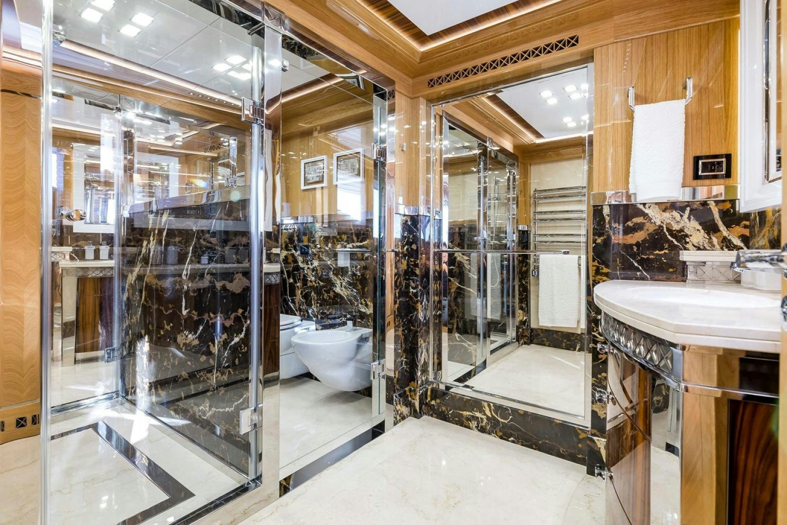 a bathroom with a glass shower aboard VIATORIS Yacht for Sale