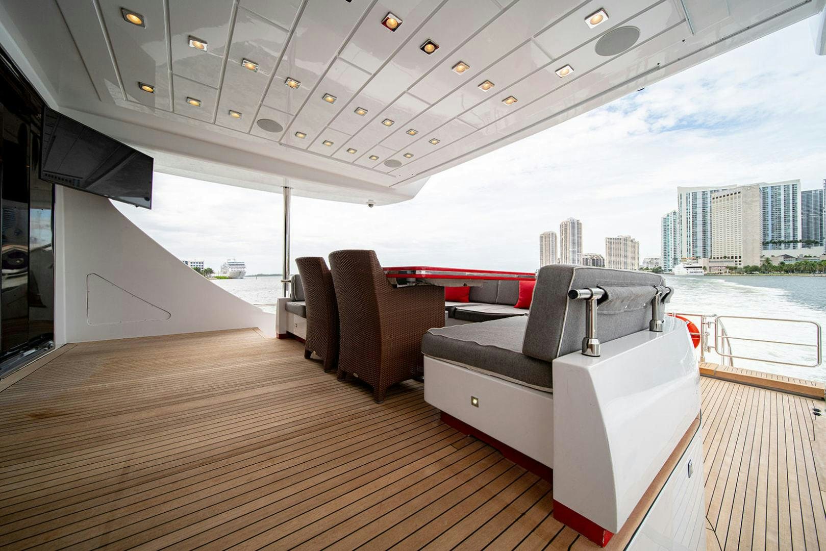 a large living room with a large window and a view of a city aboard HARMONIC WAVES Yacht for Sale