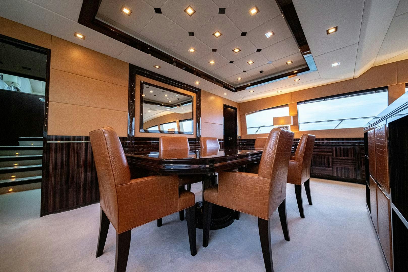 a room with a table and chairs aboard HARMONIC WAVES Yacht for Sale