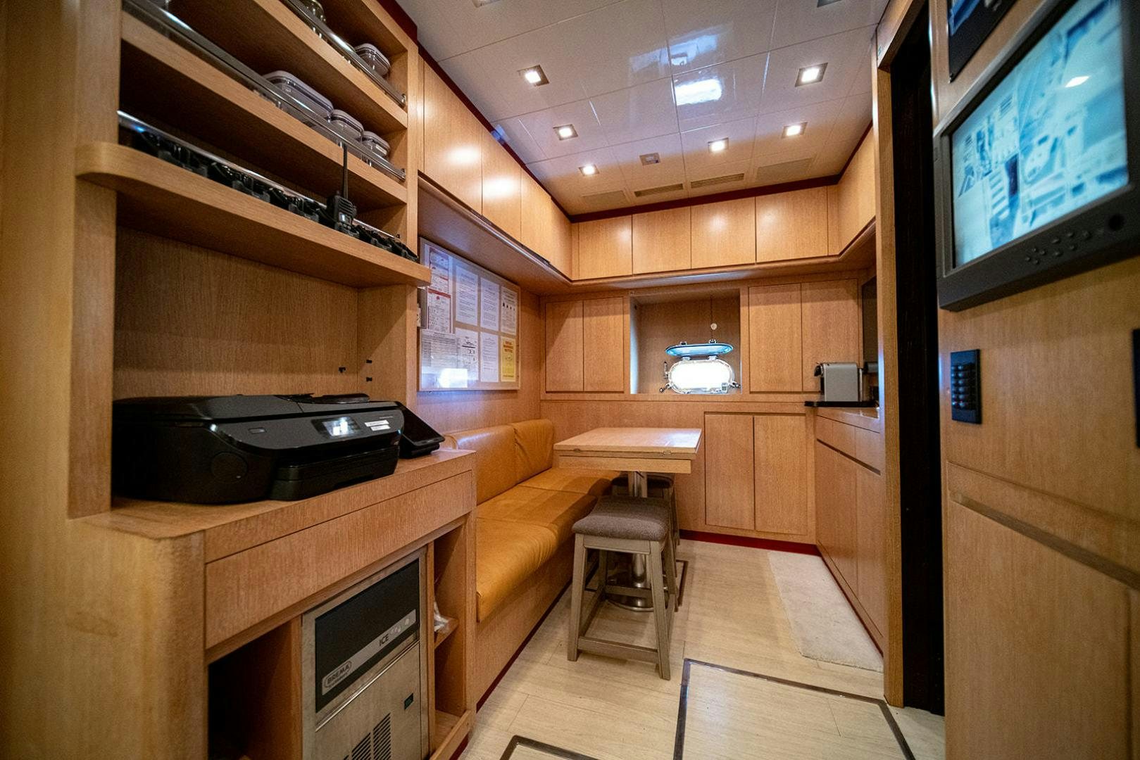 a room with a tv and a couch aboard HARMONIC WAVES Yacht for Sale