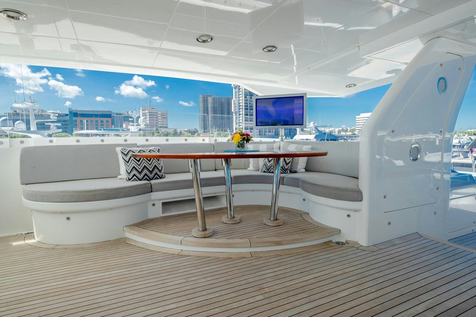 a table with a bench on it aboard FUGITIVE *NAME RESERVED* Yacht for Sale